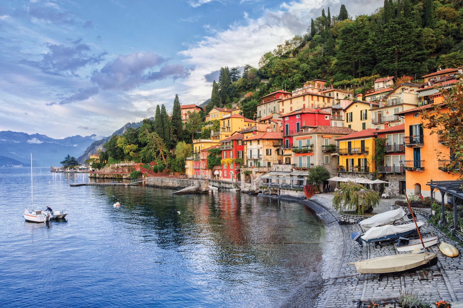 Houses and boats on the shore of Lake Como, near Villa della Vetta in Italy