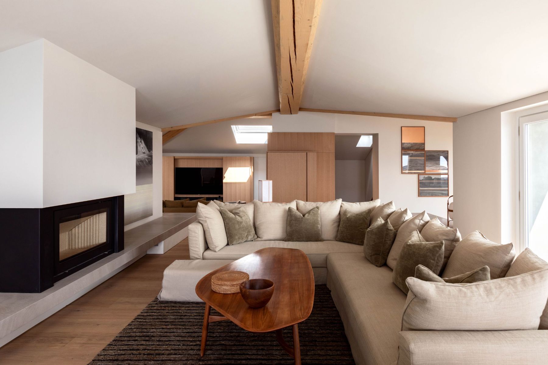 Lounge area with large sofa and coffee table at Villa Della Vetta in Lake Como