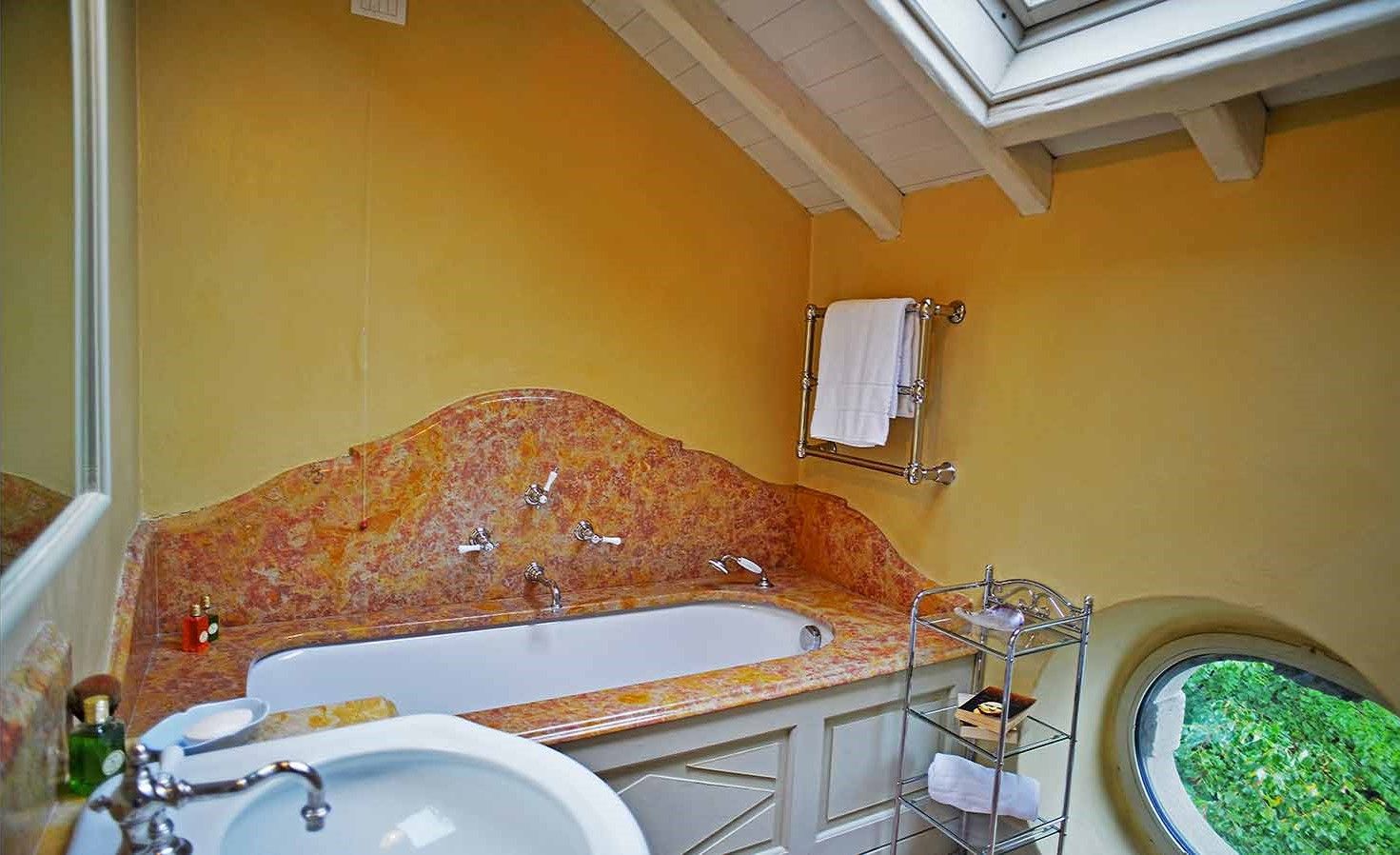 Bathroom with skylight and bathtub at Villa Maria Taglioni on the Italian Lakes