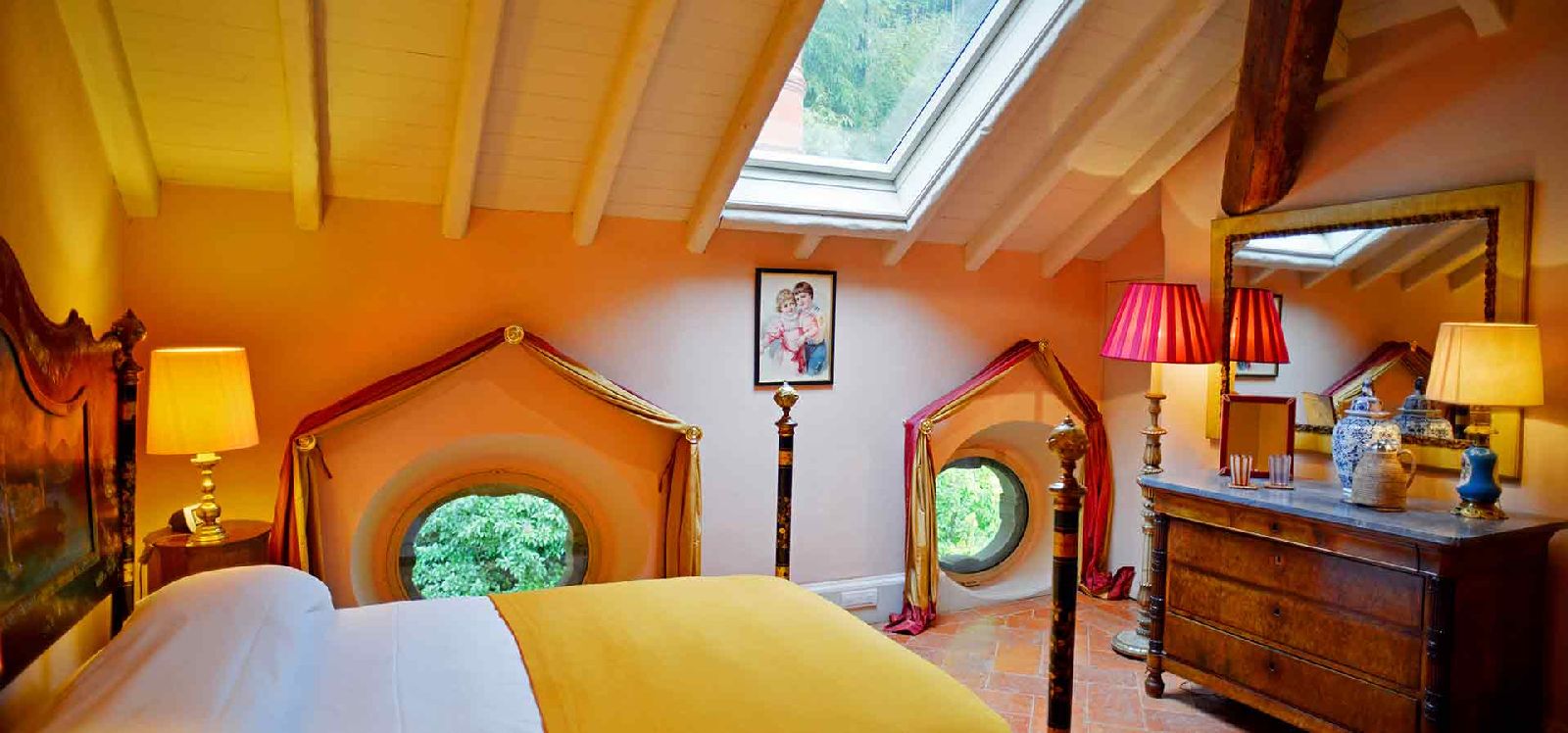 Double bedroom with yellow sheets at Villa Maria Taglioni on the Italian Lakes