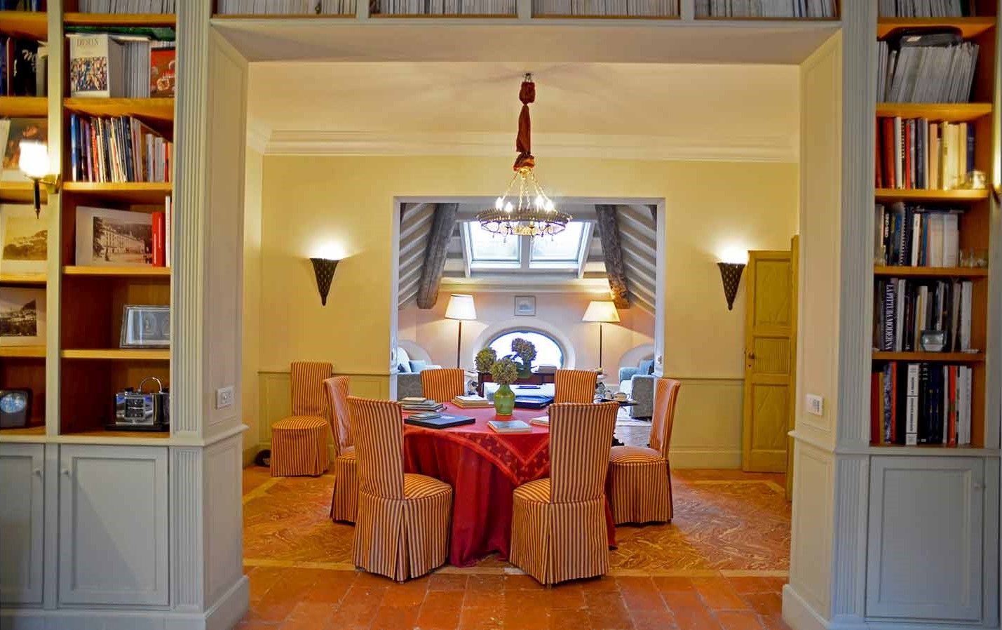 Dining room with fabric covered chairs at Villa Maria Taglioni on the Italian Lakes