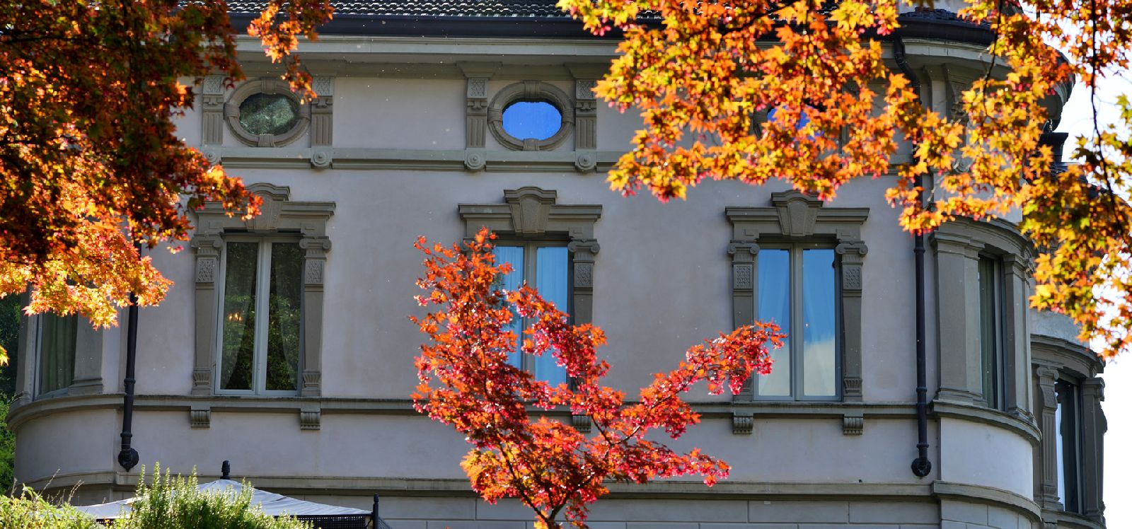 Windows of property with autumnal leaves at Villa Maria Taglioni on the Italian Lakes