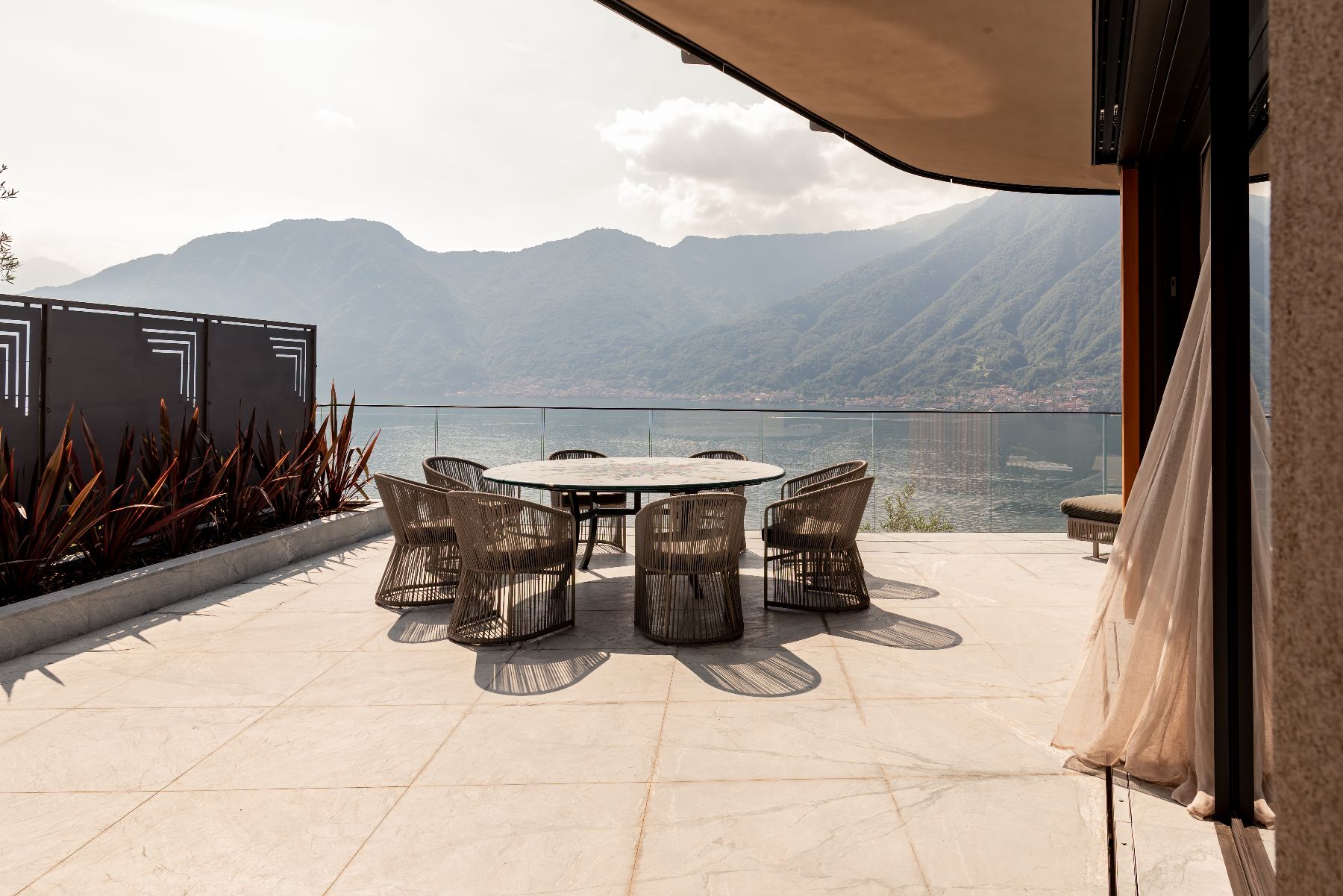 Outdoor seating area with lake view at Villa Orizzonte in Lake Como