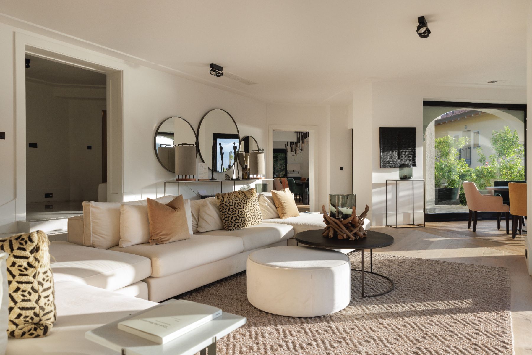 Contemporary lounge with large white sofa at luxury vacation rental, Villa Pola on Lake Como, Italy
