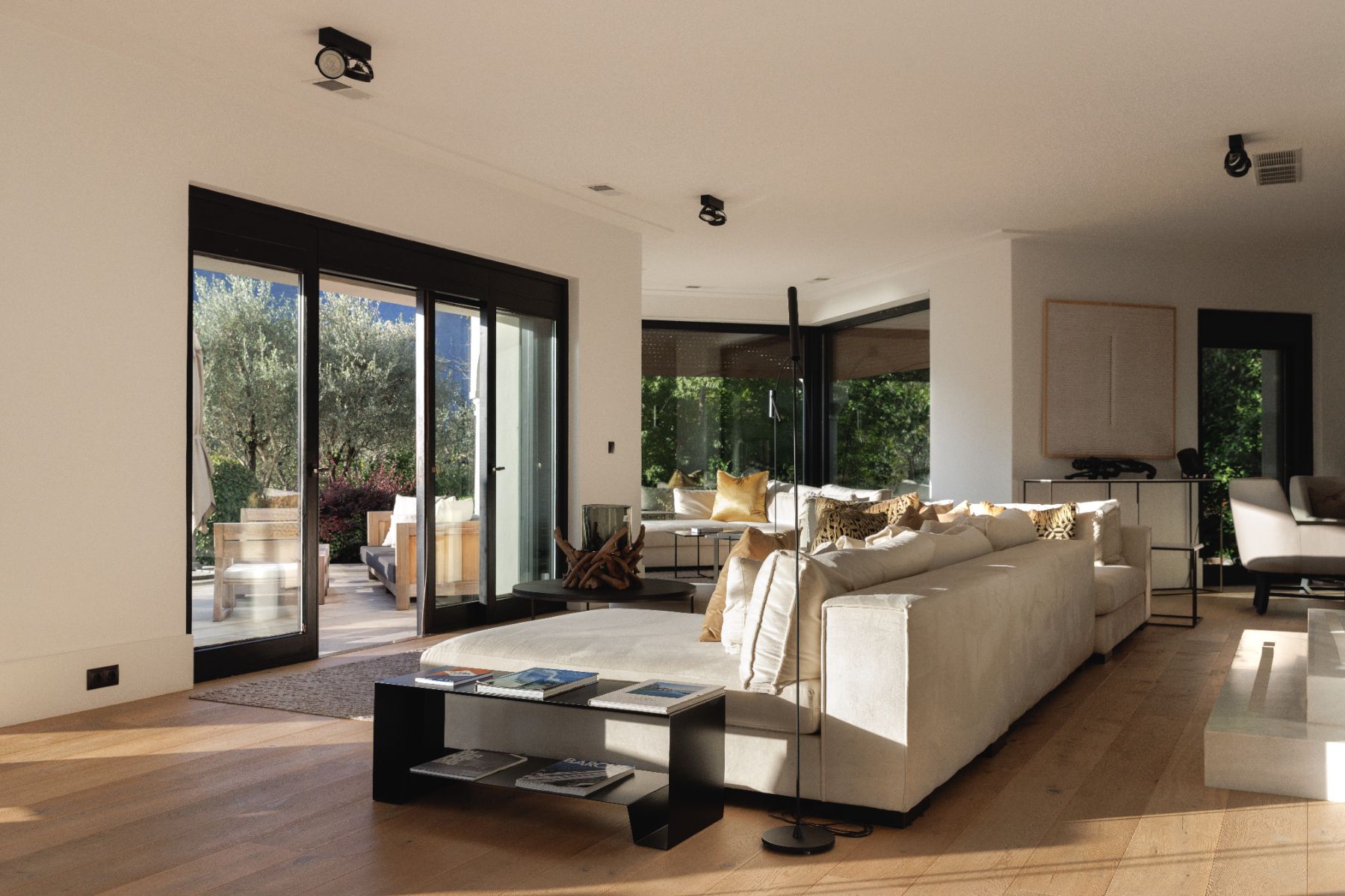 Lounge looking through French windows at private rental Villa Pola at Lake Como in the Italian Lakes, Italy