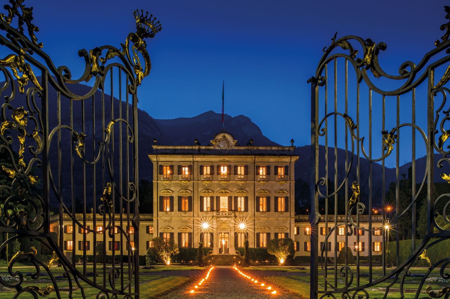 Exterior of Villa Sola Cabiati at night in Lake Como, Italy