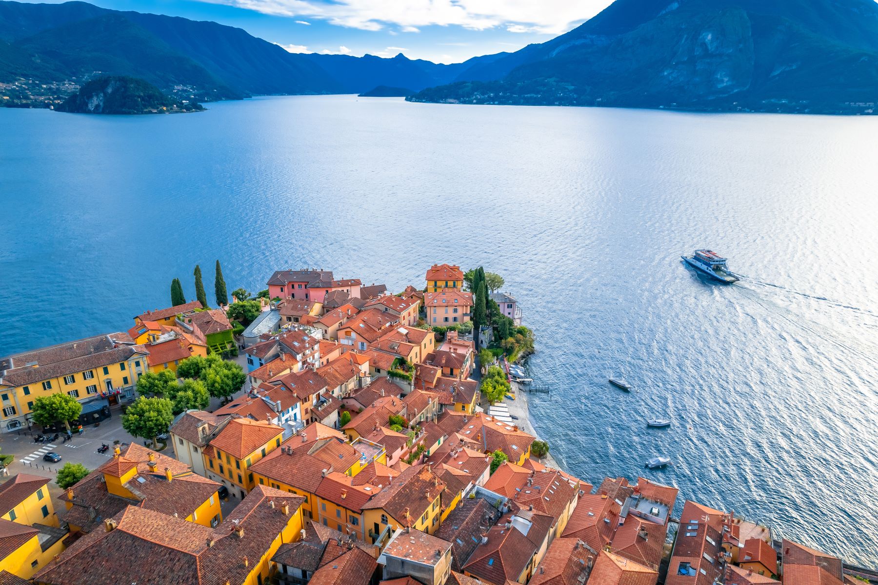 Aerial view of a ferry crossing Lake Como from Varenna