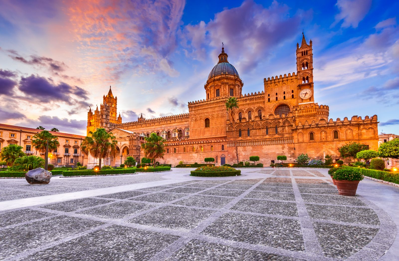 Exterior view of the Palermo Cathedral at sunset