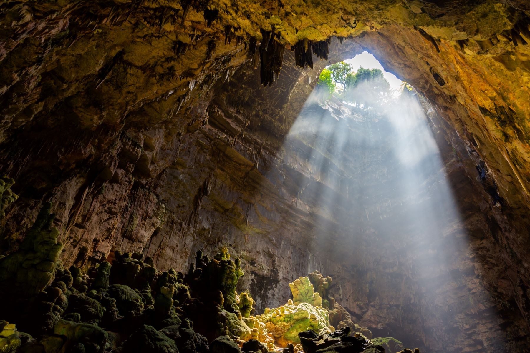 Rays of sunlight illuminating a section of the Castellana caves in Puglia