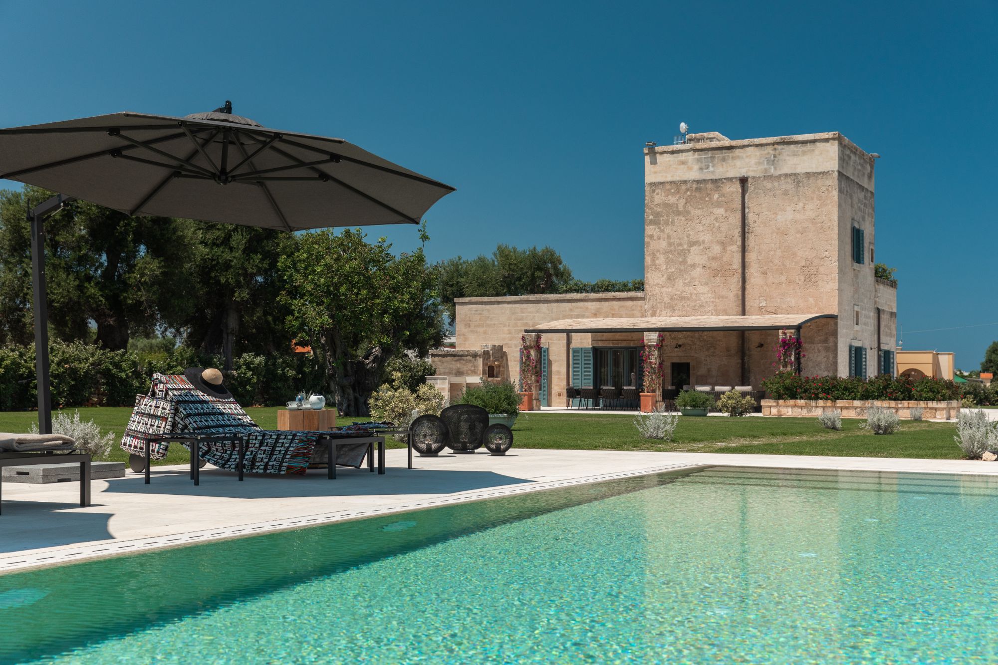 Pool with loungers at La Piccola 