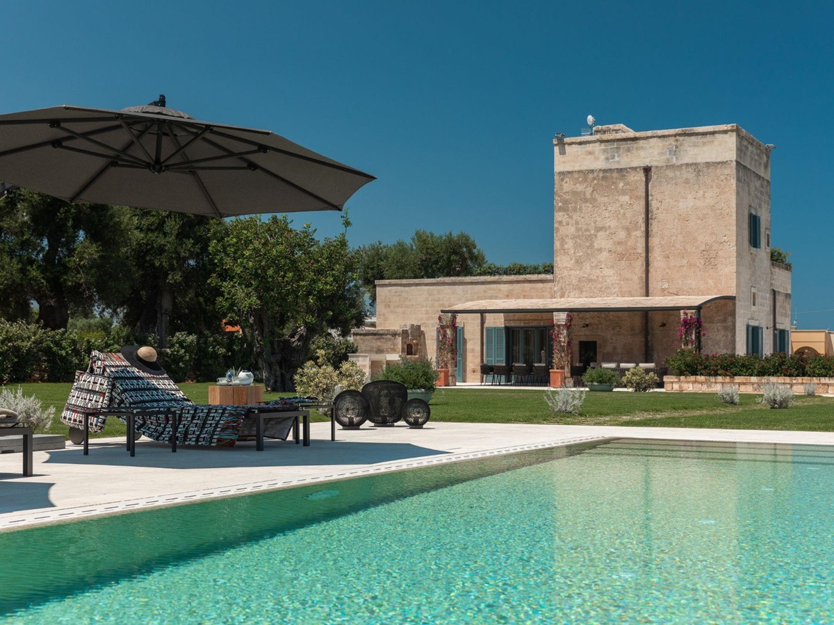 Pool with loungers at La Piccola