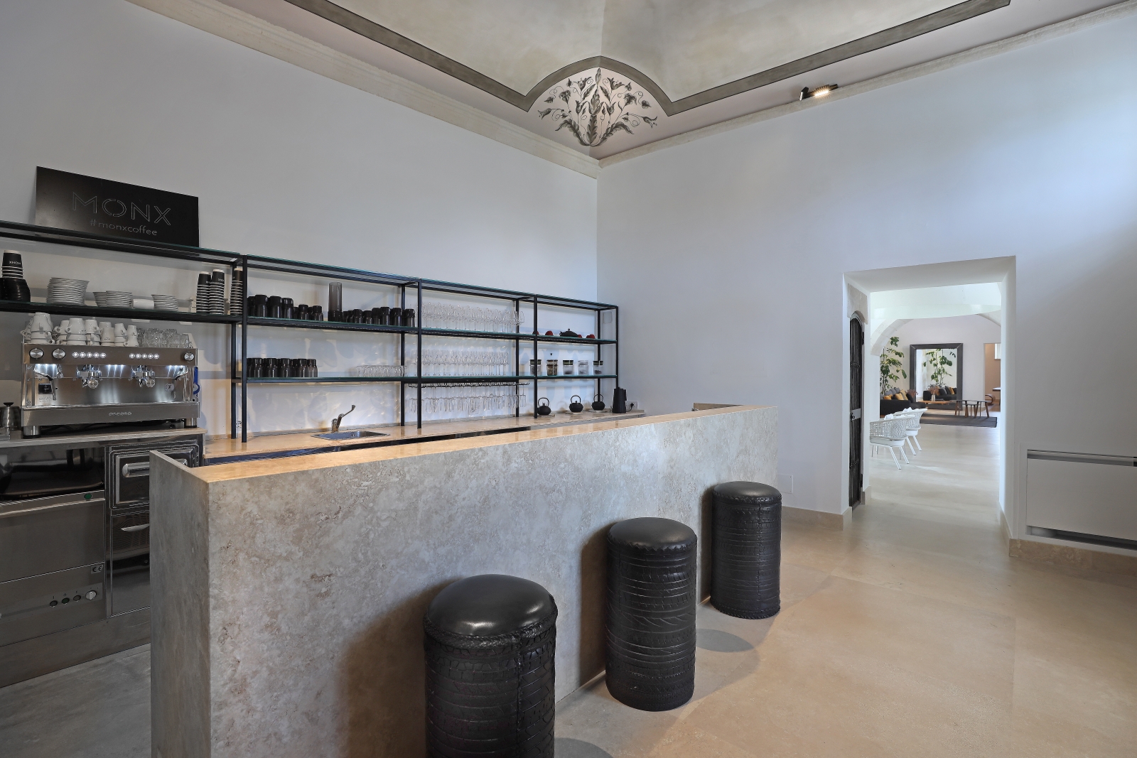 Bar with stools, shelves, coffee machine and crockery at Masseria dei Papi in Puglia, Italy