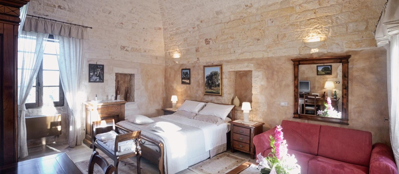 En suite double bedroom in Masseria Messapica, Puglia