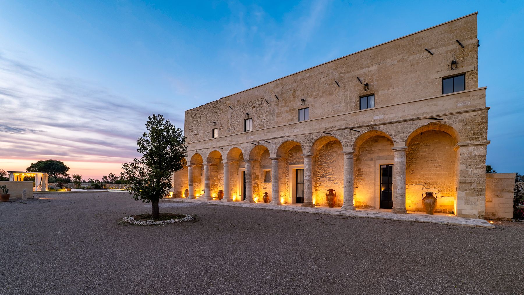 Exterior view of Masseria Salento in Puglia at sunset