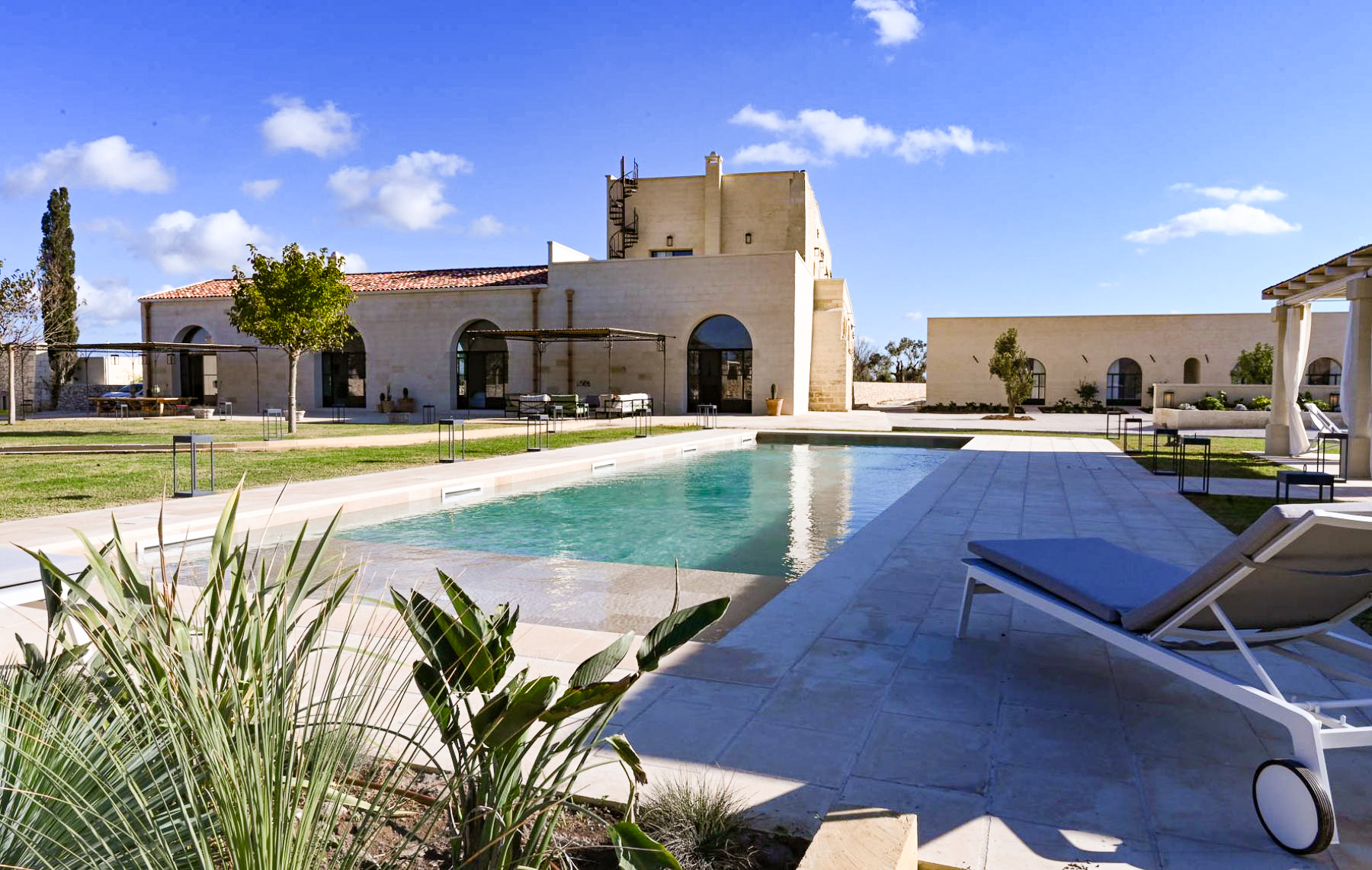 Swimming pool and exterior view of Masseria Salento in Puglia