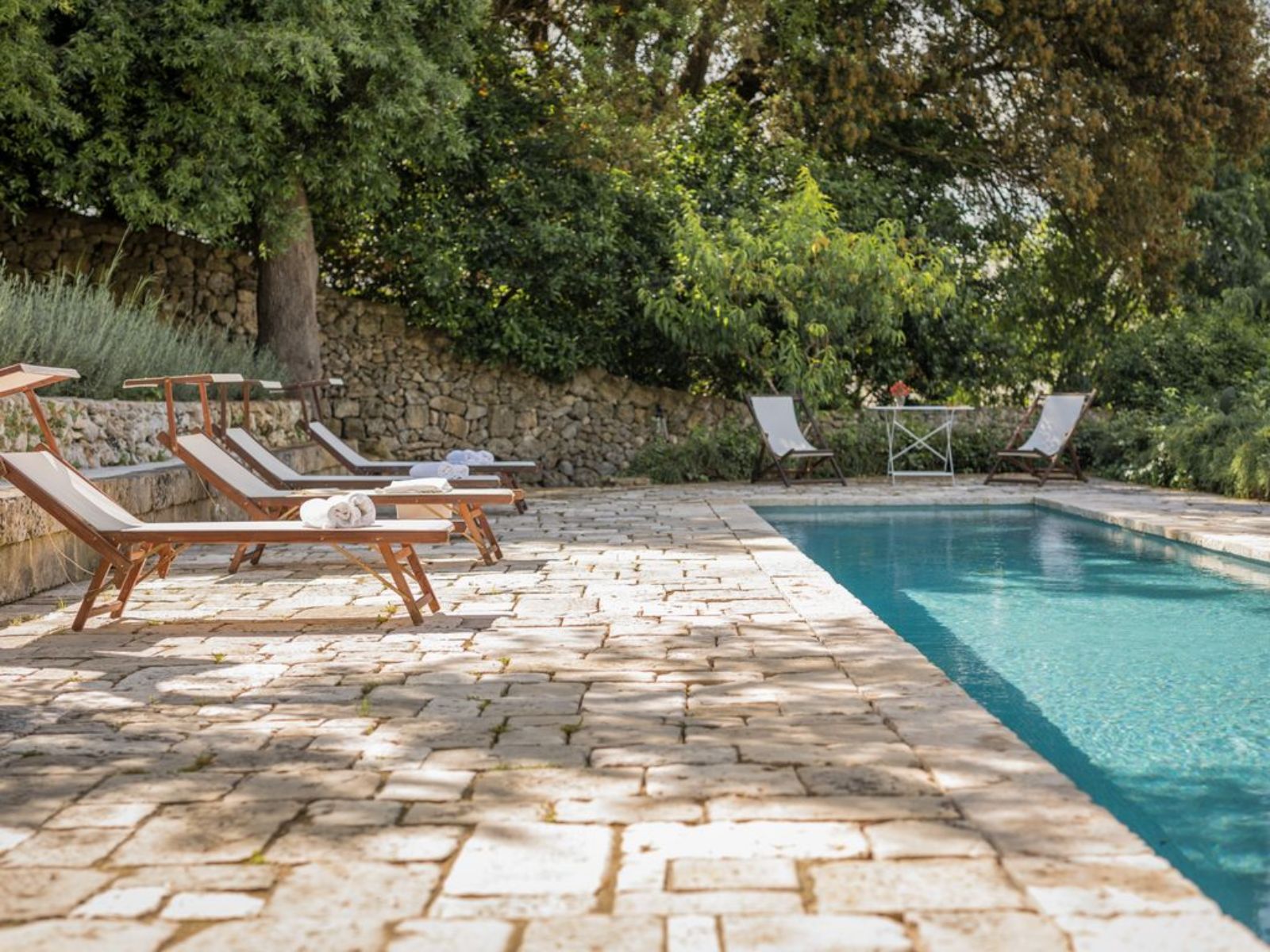 Pool with loungers at Palazzo Isonzo