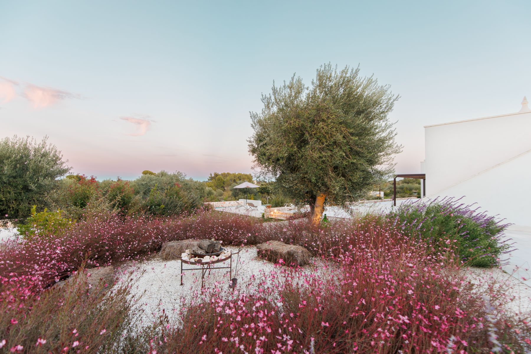 Outdoor area and fireplace at Trulli Armonia in Puglia