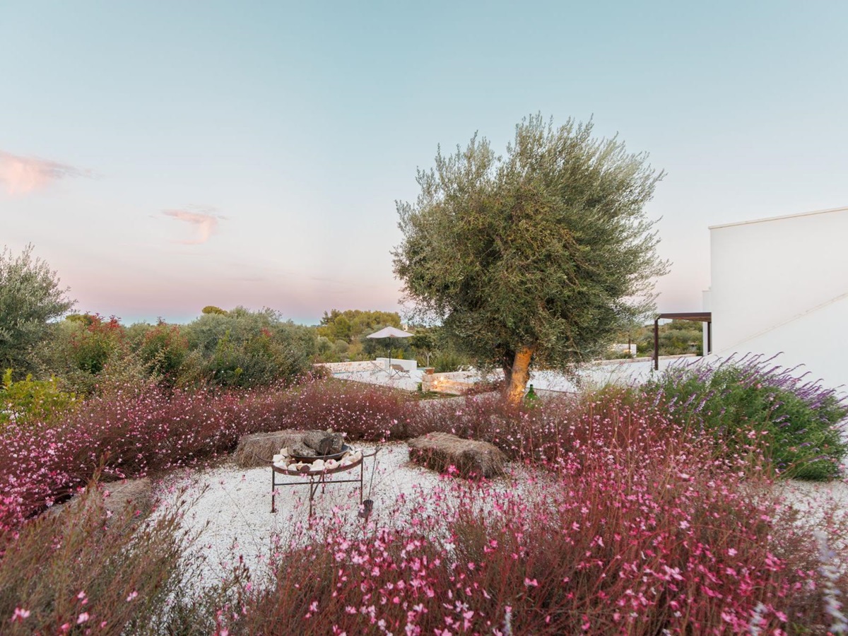 Outdoor area and fireplace at Trulli Armonia in Puglia