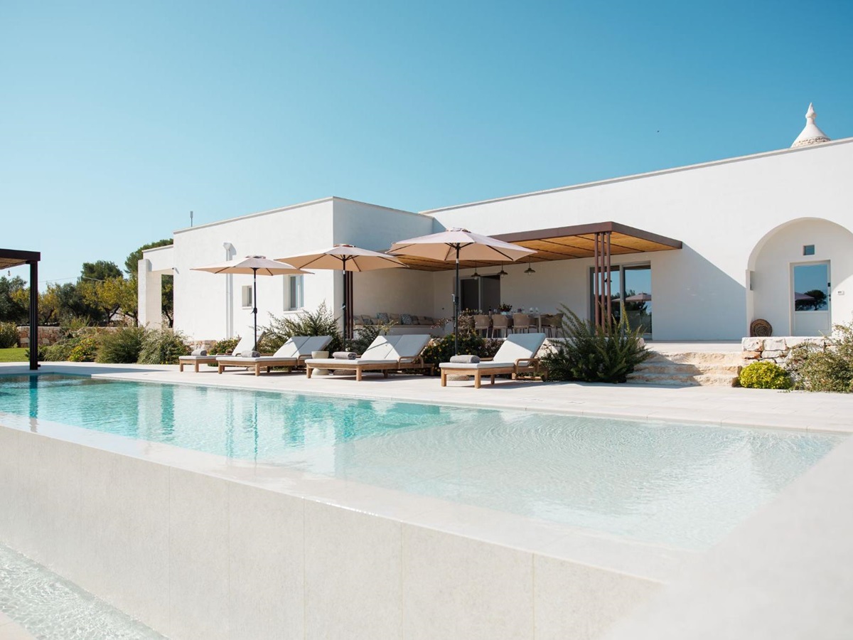 Low angle of pool and villa at Trulli Armonia in Puglia