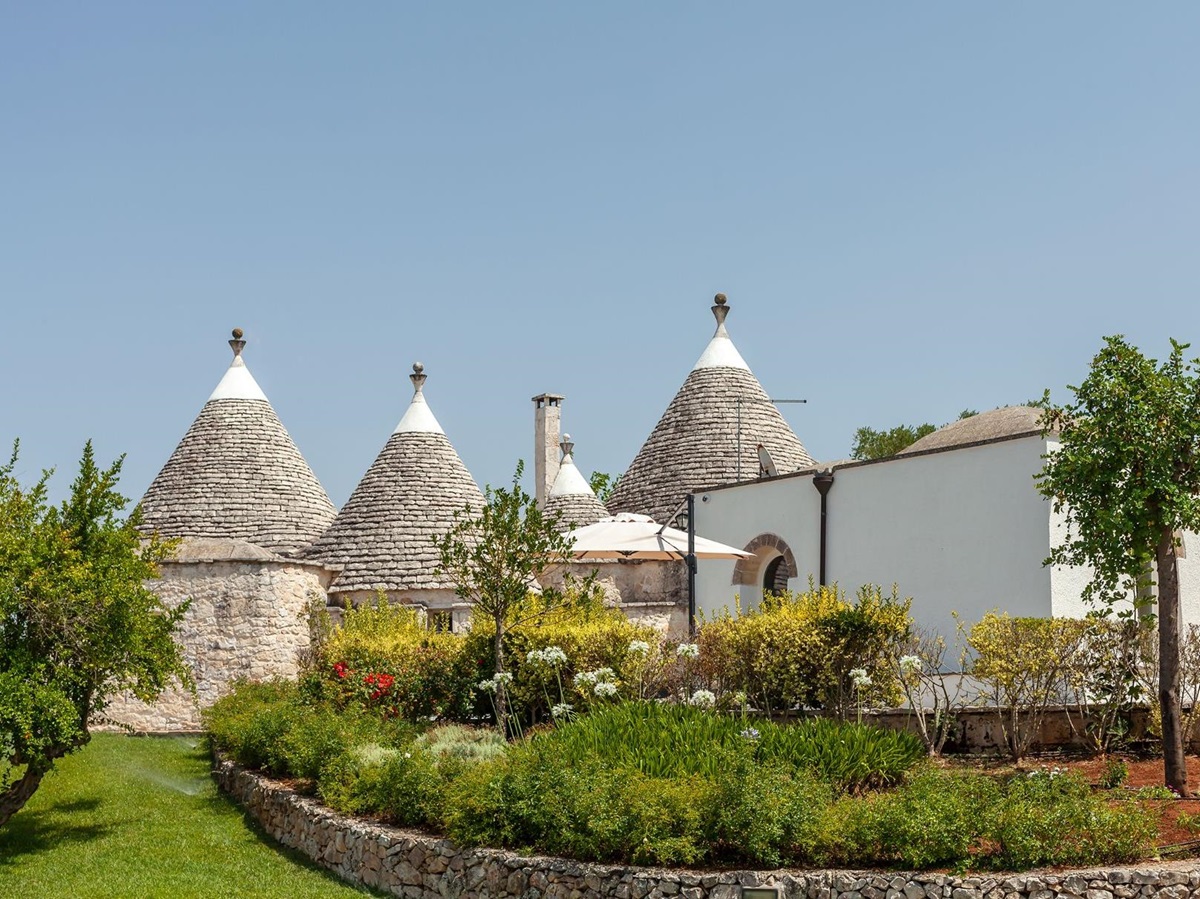 Exterior view of villa and gardens at Trulli Lucia in Puglia