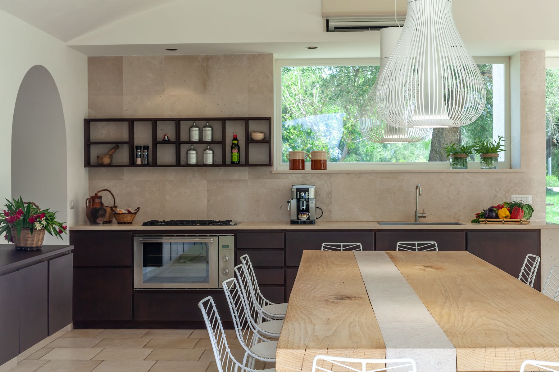 Indoor kitchen table and counters at Trulli Lucia in Puglia