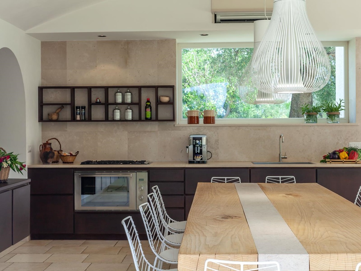 Indoor kitchen table and counters at Trulli Lucia in Puglia