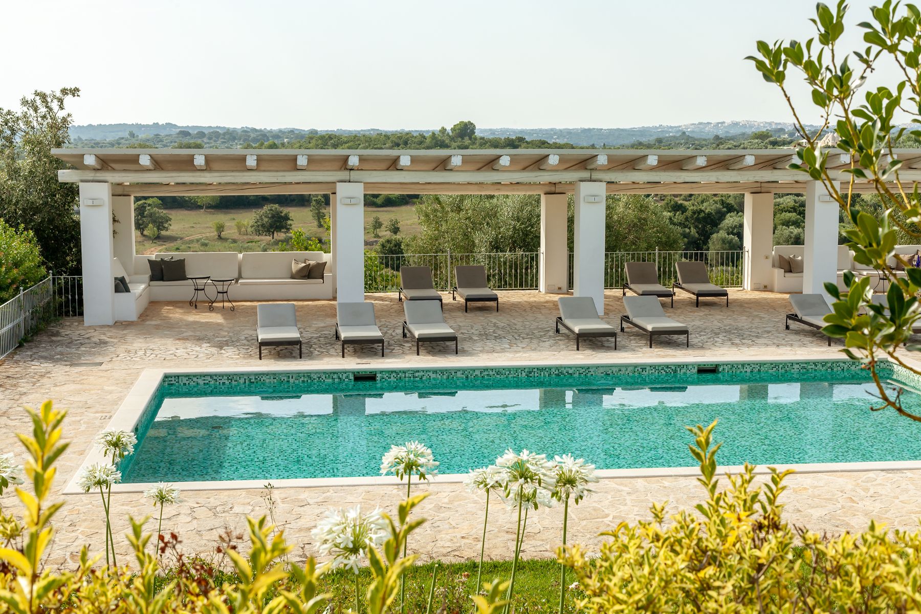 Higher angle of pool and terrace at Trulli Lucia in Puglia