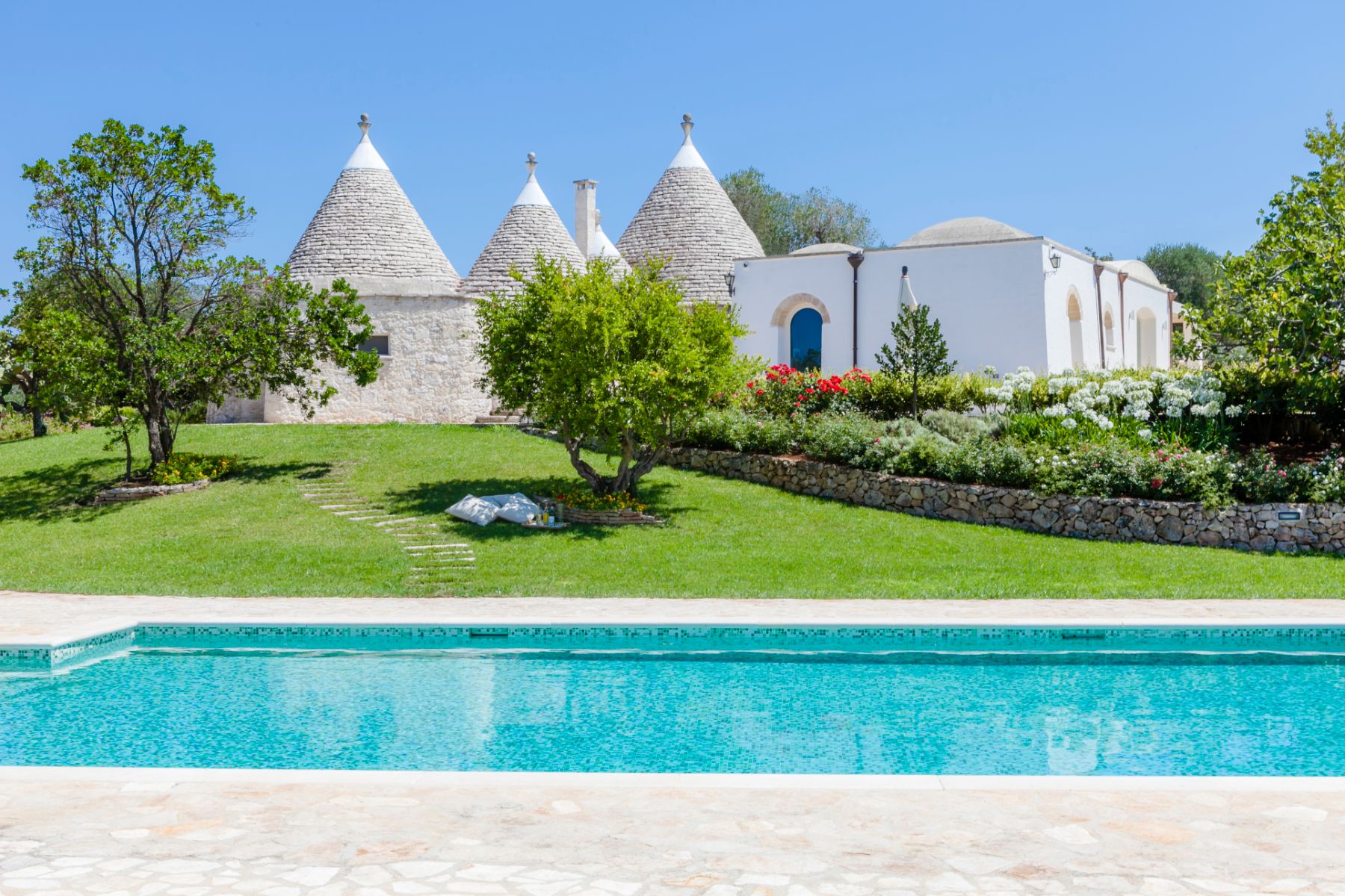 Exterior view and pool at Trulli Lucia in Puglia