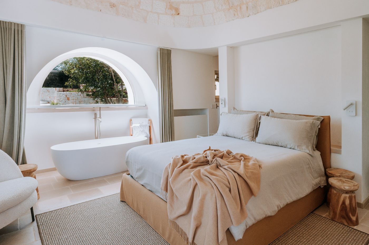 A bedroom at Trulli Pomona.