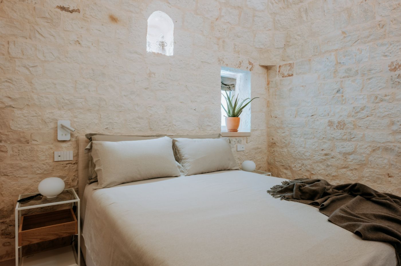 A bedroom at Trulli Pomona.