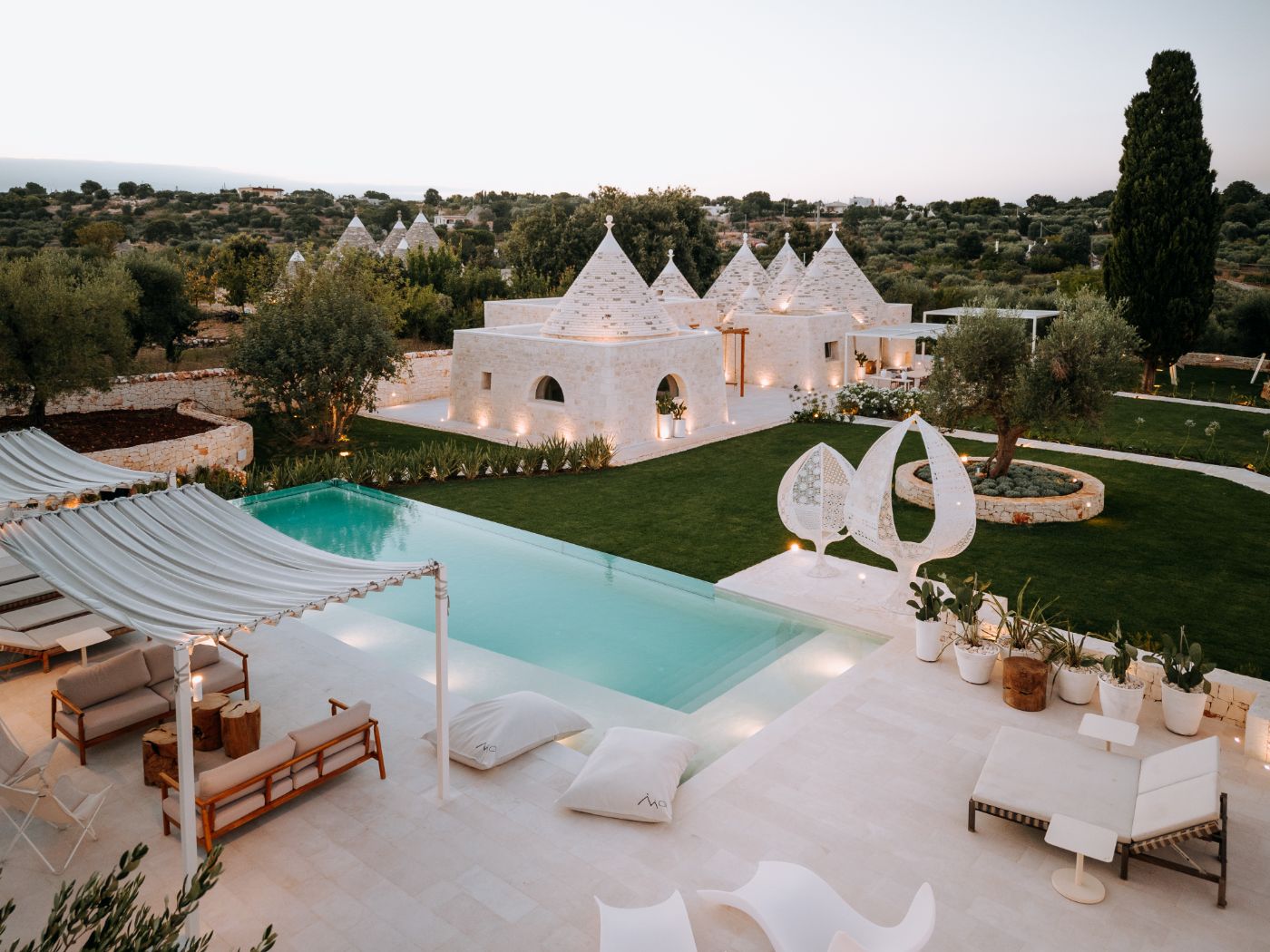 The pool seating area at Trulli Pomona.