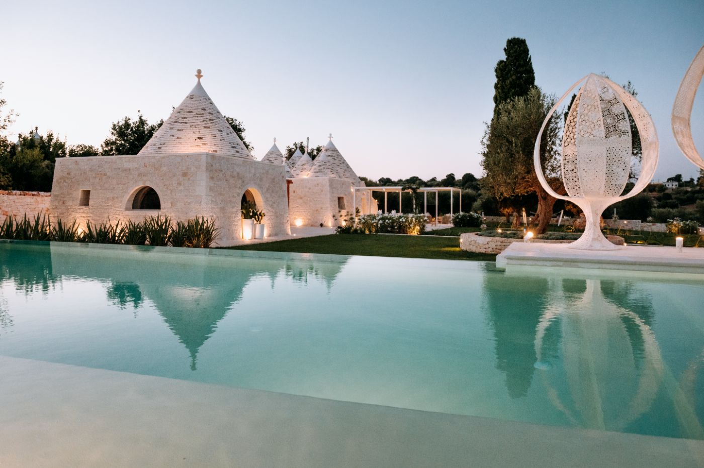 The pool area and Trulli of Trulli Pomona.