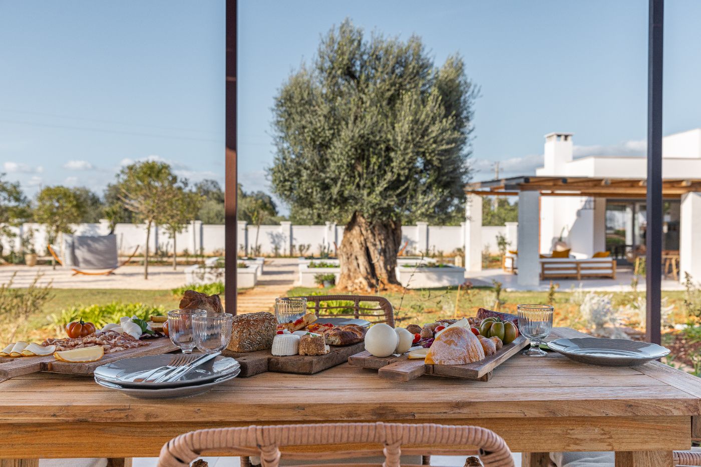 Outdoor dining by the pool at Villa Oliva.
