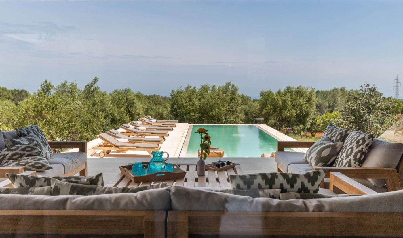 The pool seating area at Villa Venere.