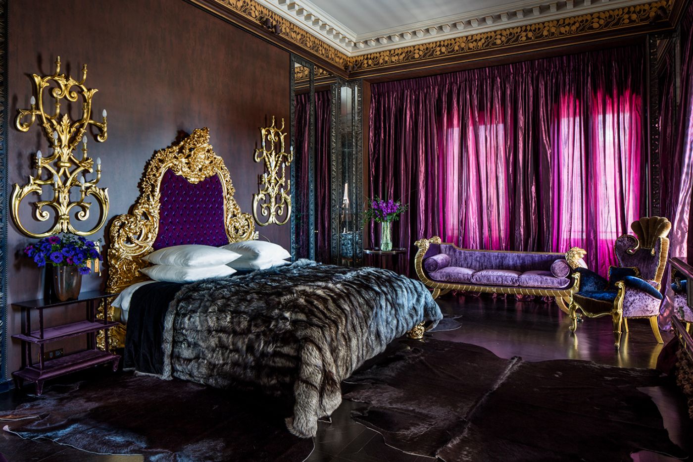 The Master Suite bedroom with a matching sofa and chair at Villa Clara.