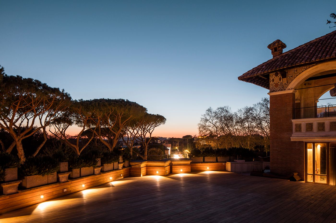 The large rooftop terrace at sunset at Villa Clara.