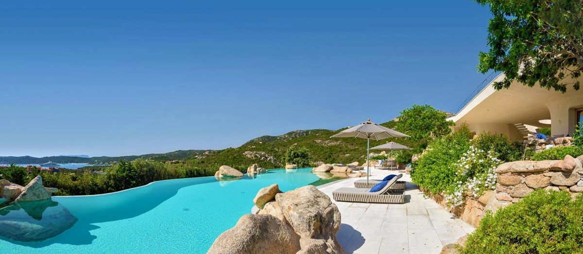 Large pool with loungers and sea views at The Rock, luxury villa in Sardinia