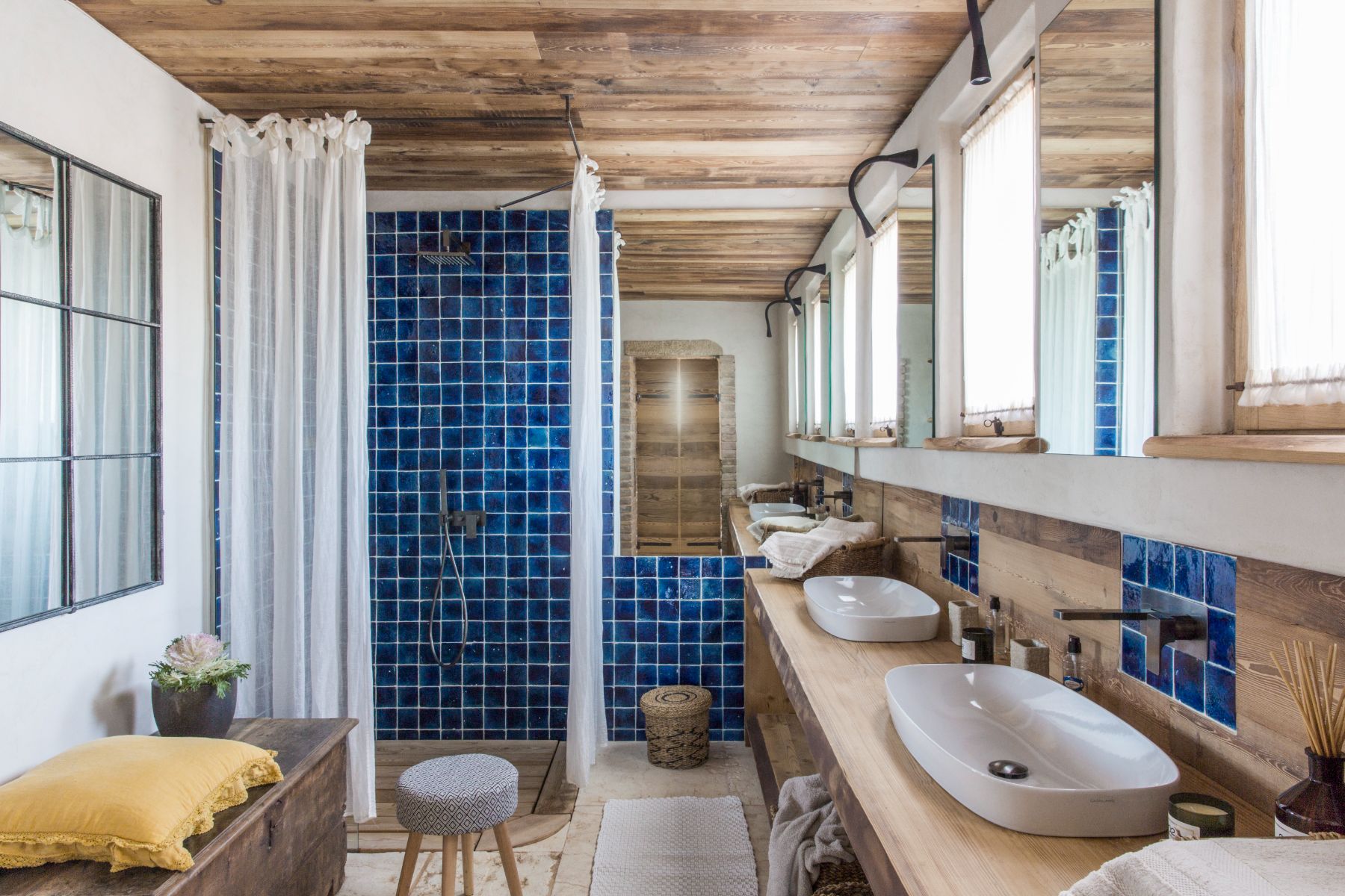 Blue tile bathroom at Borgo Rinato in Tuscany