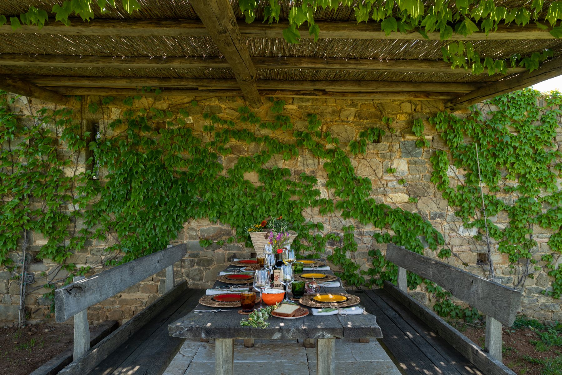 Outdoor dining table at Borgo Rinato in Tuscany