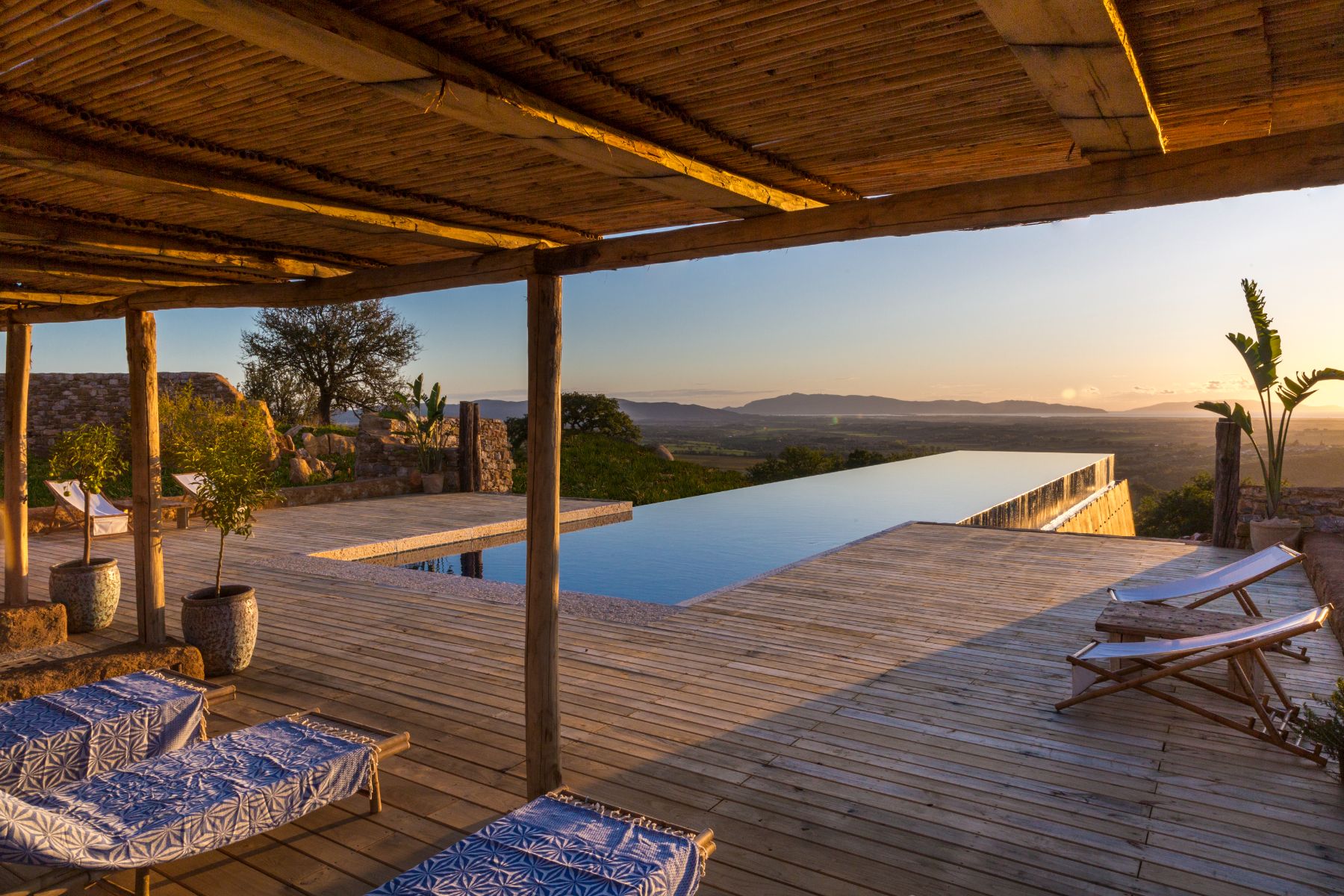 Pool and sun loungers at Borgo Rinato in Tuscany