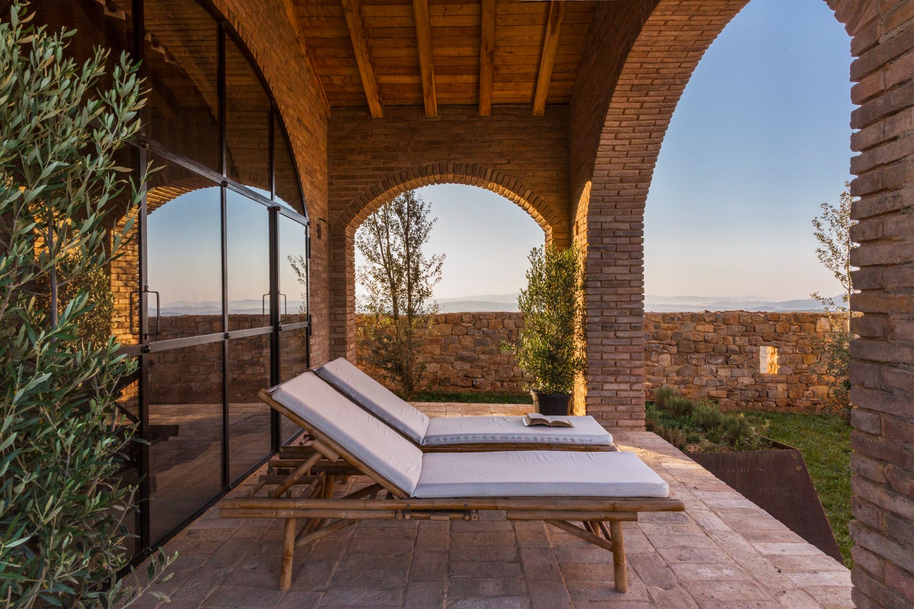 Sun loungers on the terrace at Borgo Rinato in Tuscany