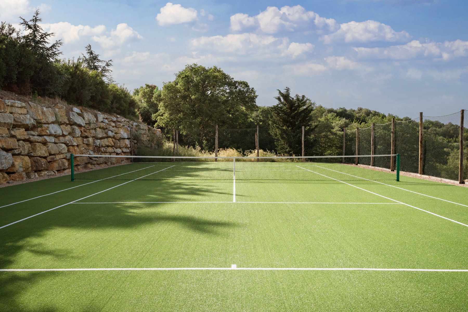 Tennis court at Borgo Rinato in Tuscany