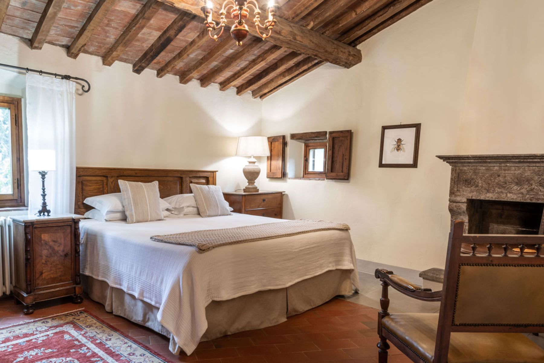 Bedroom with chair at Casa Picchio in Tuscany