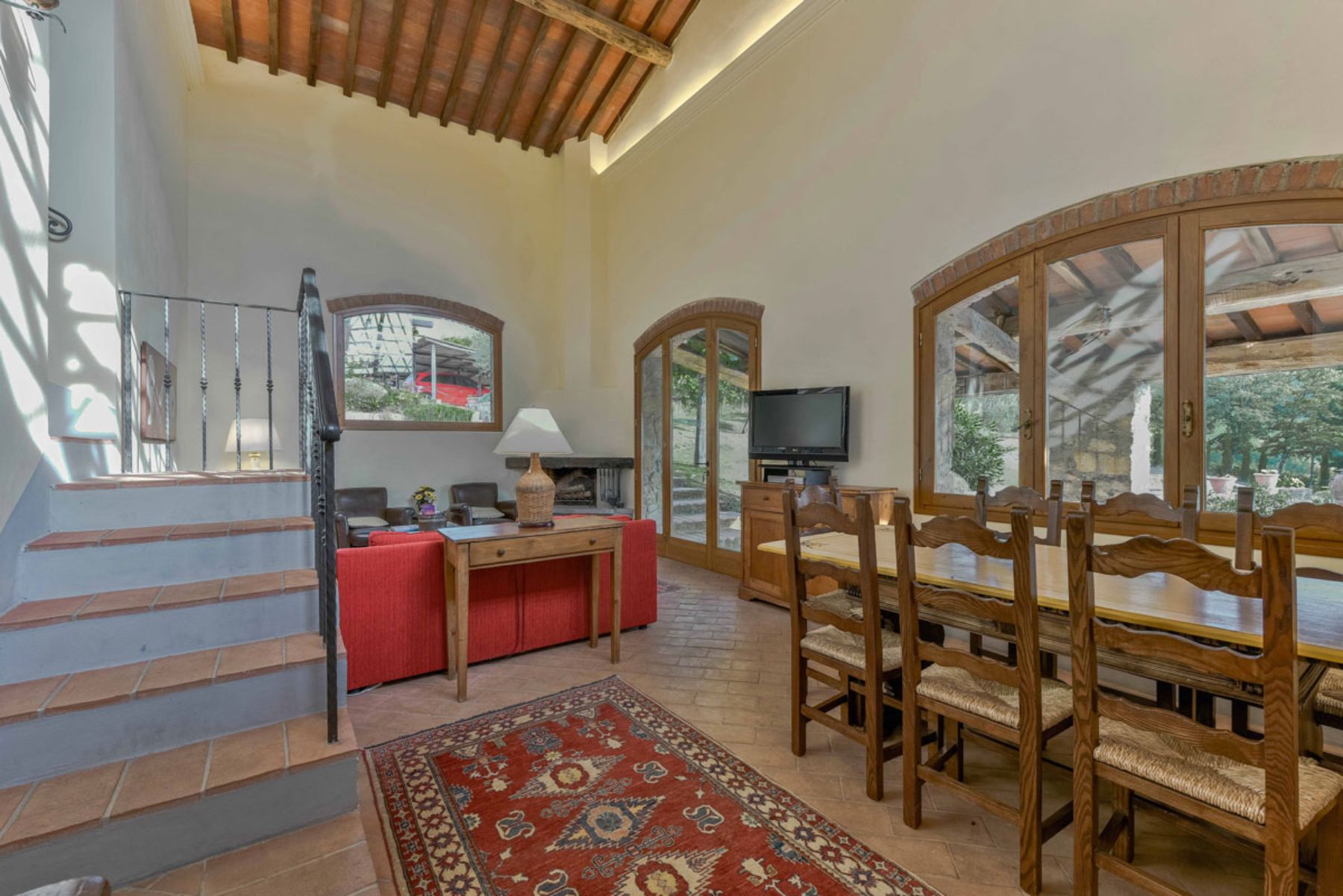 Dining table and communal space at Casa Picchio in Tuscany