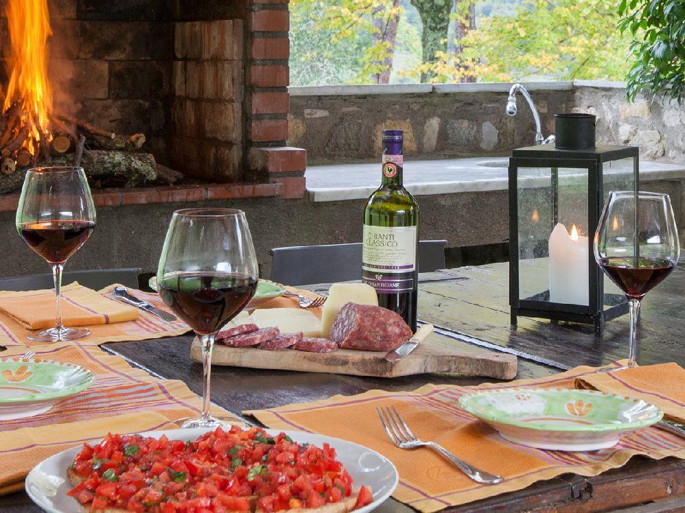 Tuscan dining in the loggia at villa Casale di Fiesole near Florence