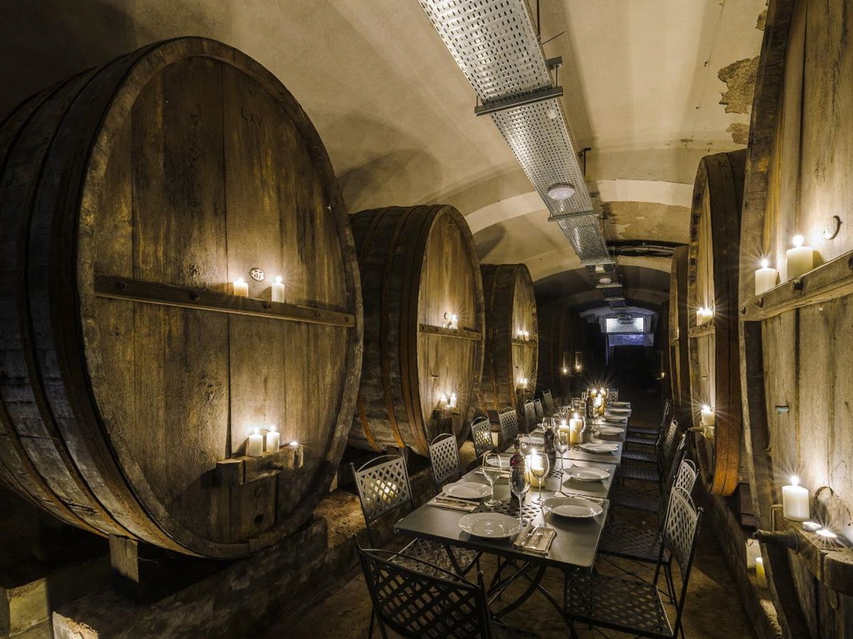 Dining area amongst the wine barrels of Castello San Lorenzo.