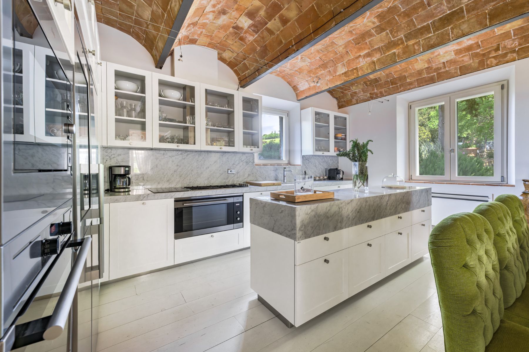 Modern kitchen with marble surfaces and a tiled roof in Villa Il Mugnello in Tuscany