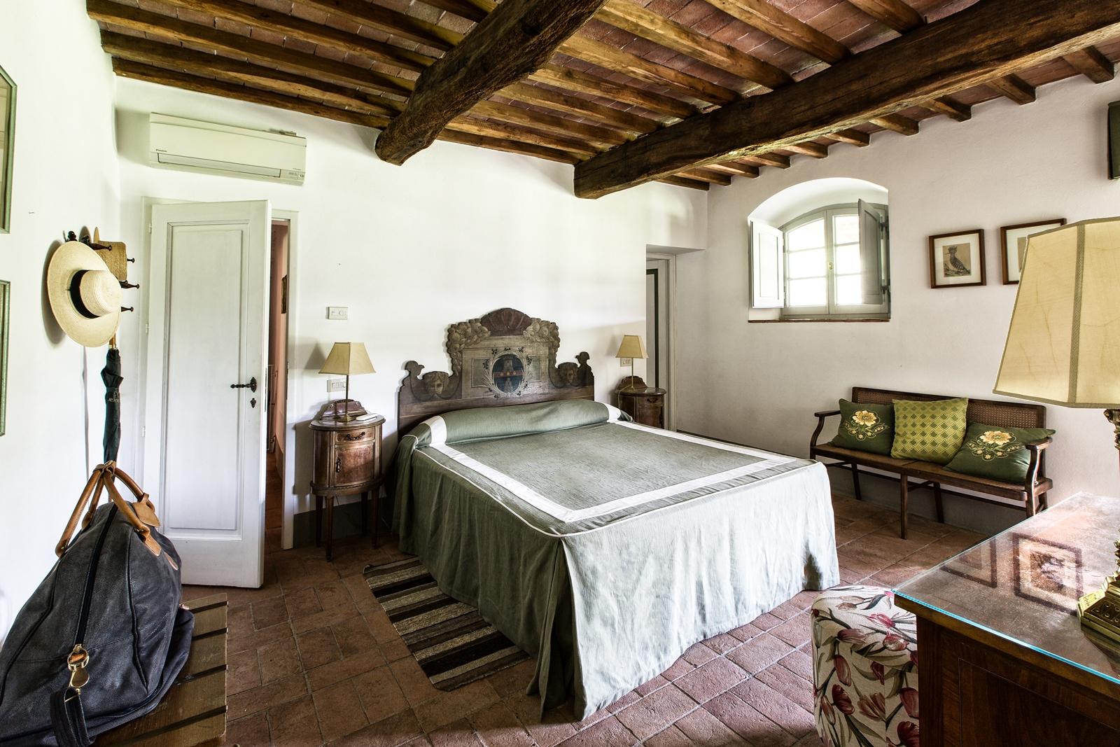 The green double bedroom in Il Prato di Vignamaggio, Chianti, Tuscany
