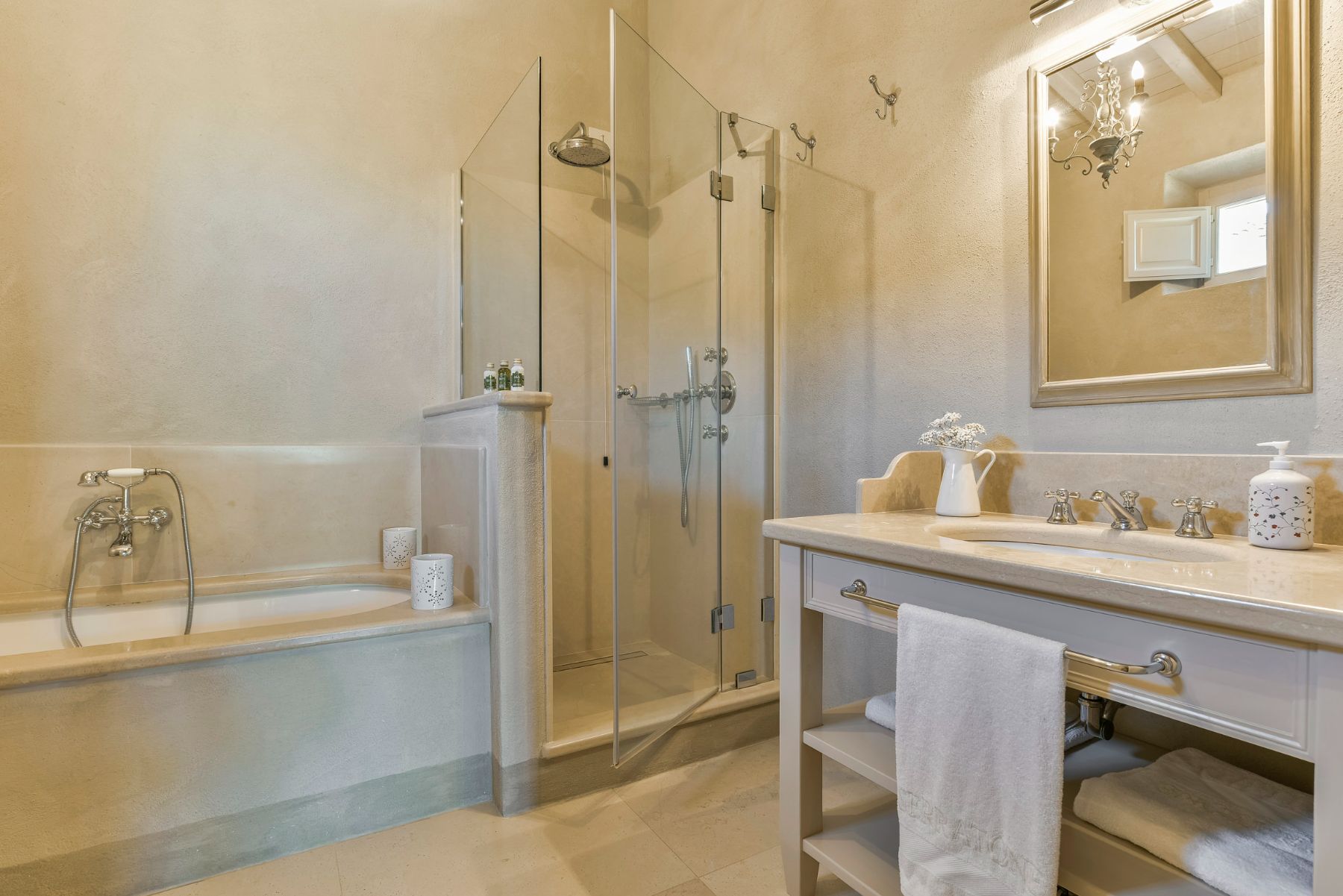 bathroom with bath, shower and basin at Villa Il Serratone in Tuscany