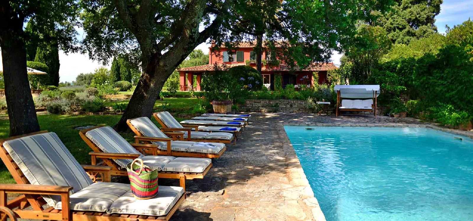 Swimming pool and terrace of villa La Civetta in Tuscany